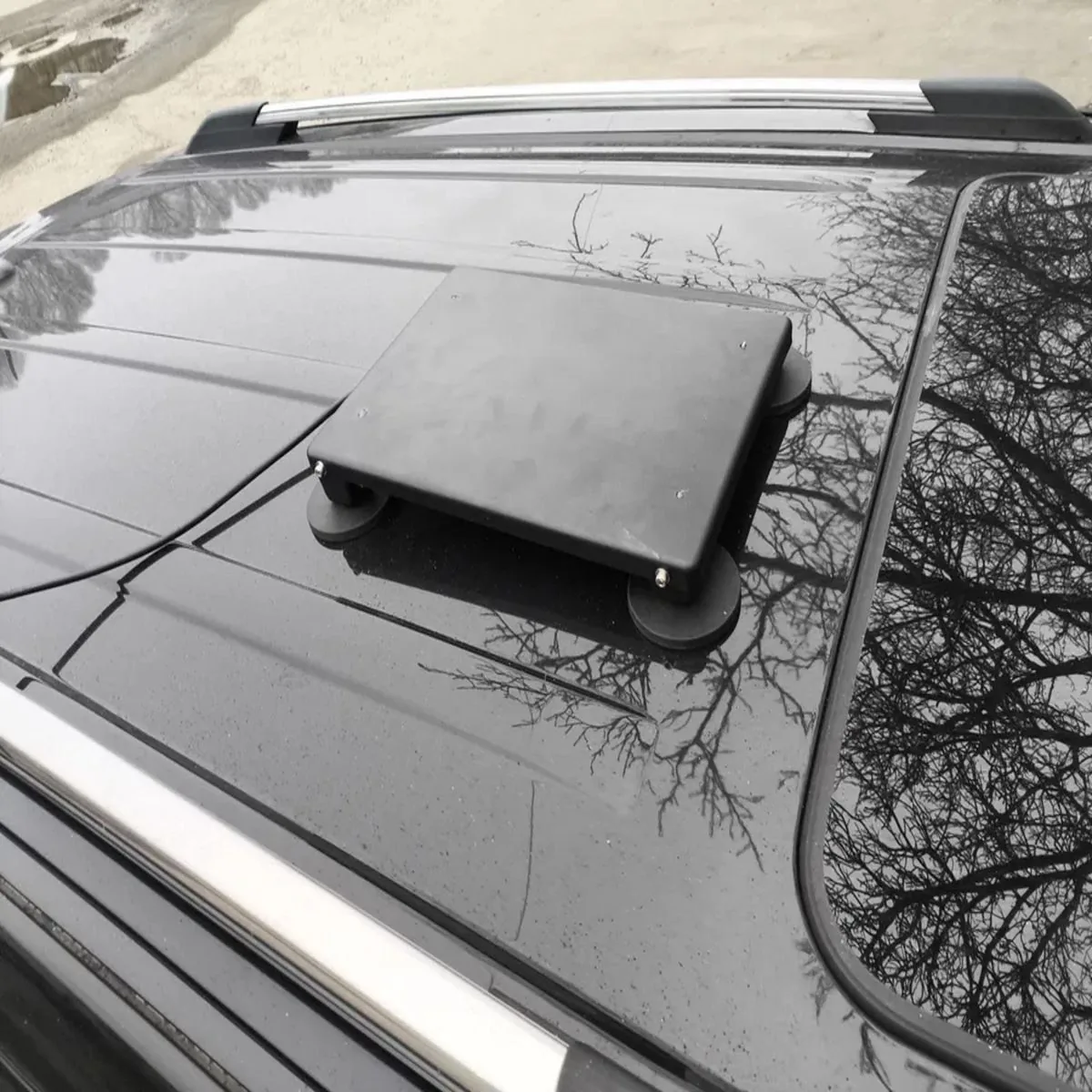 Starlink Mini on a suction mount fixed flat to the roof panel of a camper, cable running forward